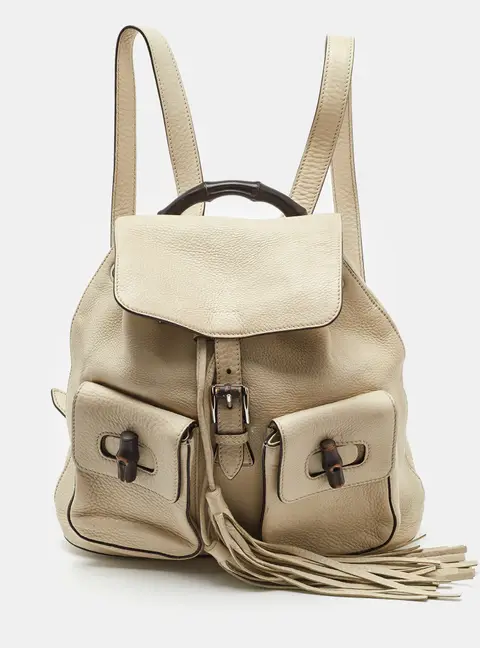 Gucci Off White Pebbled Leather GG Bamboo Tassel Backpack