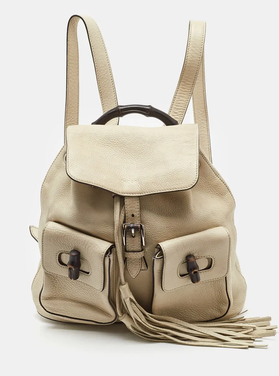 Gucci Off White Pebbled Leather GG Bamboo Tassel Backpack