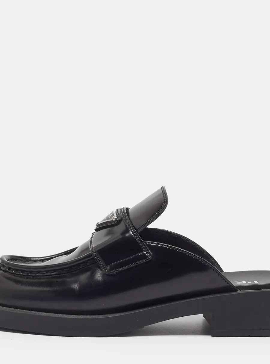 Prada Size 40.5 Black Leather Logo-Plaque Mules
