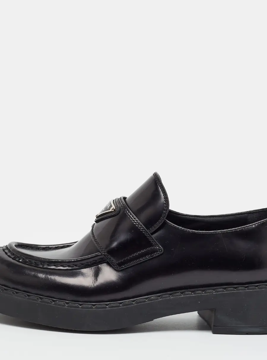 Prada Size 39.5 Black Leather Triangle Logo Plaque Penny Loafers
